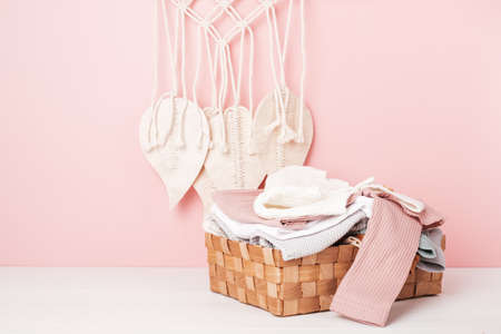 Baby and child clothes in the box. Second hand apparel idea. Circular fashion, donation, eco friendly sustainable lifestyle, thrifting shop concept.の写真素材