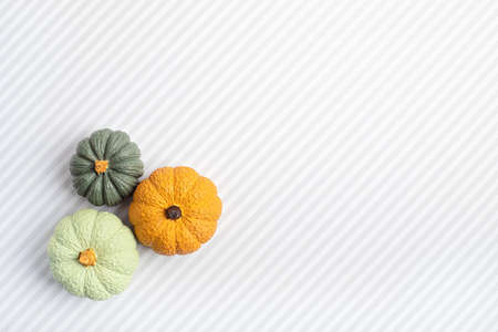 Flat lay with handmade painted gypsum pumpkins and copy space. Autumn holidays card mockup