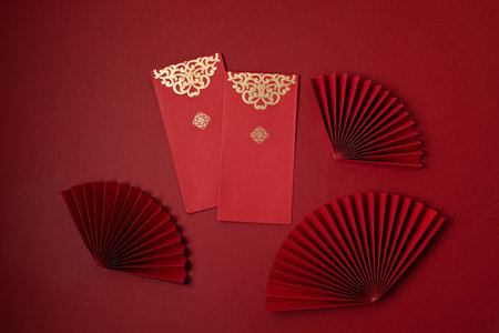 Chinese new year festival decoration over red background. traditional lunar new year red pockets