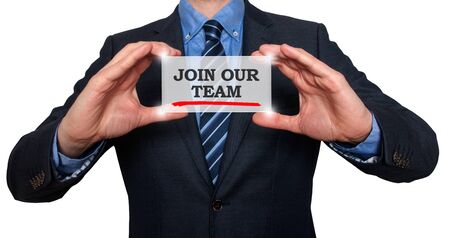 Businessman holding white card with Join our team sign, Blue backgroundの写真素材