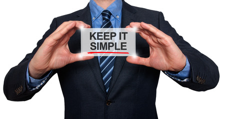 Keep It Simple in a navigation bar on a virtual screen with a businessman holding it. White backgroundの写真素材