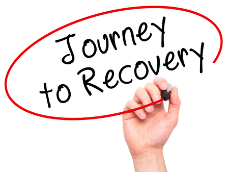 Man Hand writing Journey to Recovery with black marker on visual screen. Isolated on white. Life, technology, internet concept. Stock Imageの写真素材