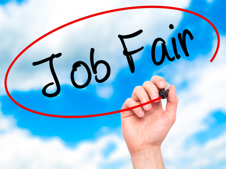 Man Hand writing Job Fair with black marker on visual screen. Isolated on sky. Business, technology, internet concept. Stock Imageの写真素材