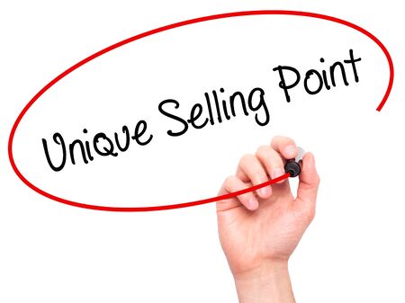 Man Hand writing Unique Selling Point with black marker on visual screen. Isolated on white. Business, technology, internet concept. Stock Photoの写真素材