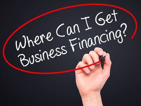 Man Hand writing Where Can I Get Business Financing? with black marker on visual screen. Isolated on background. Business, technology, internet concept. Stock Photoの写真素材