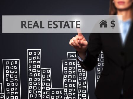 Real estate agent pressing button on virtual screen. Women finger on home icon. Business technology concept. Isolated on office. Stock Imageの写真素材