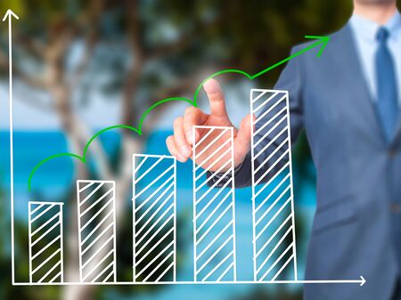 Sales Growth Graph - Businessman hand pressing button on touch screen interface. Business, technology, internet concept. Stock Photoの写真素材