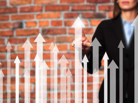 Sales Growth Graph - Businesswoman hand pressing button on touch screen interface. Business, technology, internet concept. Stock Photoの写真素材