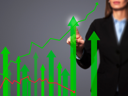Sales Growth Graph - Businesswoman hand pressing button on touch screen interface. Business, technology, internet concept. Stock Photoの写真素材