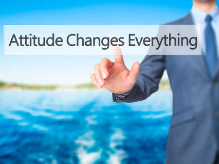 Attitude Changes Everything - Businessman hand pressing button on touch screen interface.の写真素材