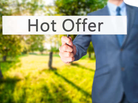 Hot Offer - Businessman hand holding sign. Business, technology, internet concept. Stock Photoの写真素材