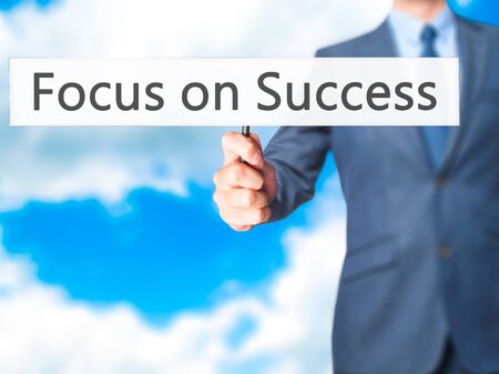 Focus on Success - Businessman hand holding sign. Business, technology, internet concept. Stock Photoの写真素材