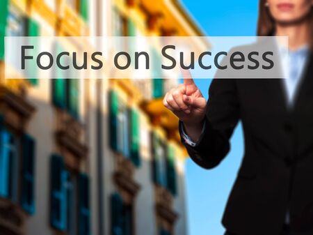 Focus on Success - Businesswoman hand pressing button on touch screen interface. Business, technology, internet concept. Stock Photoの写真素材