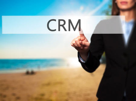 CRM -  Female touching virtual button. Business, internet concept. Stock Photoの写真素材