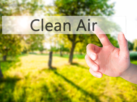 Clean Air - Hand pressing a button on blurred background concept . Business, technology, internet concept. Stock Photoの写真素材
