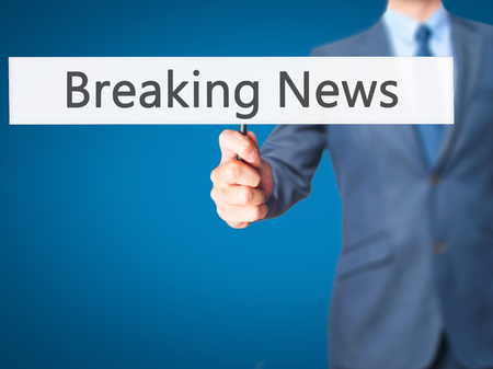 Breaking News - Businessman hand holding sign. Business, technology, internet concept. Stock Photoの写真素材