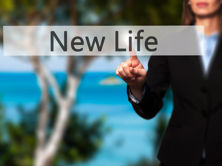 New Life - Businesswoman pressing modern  buttons on a virtual screen. Concept of technology and  internet. Stock Photoの写真素材