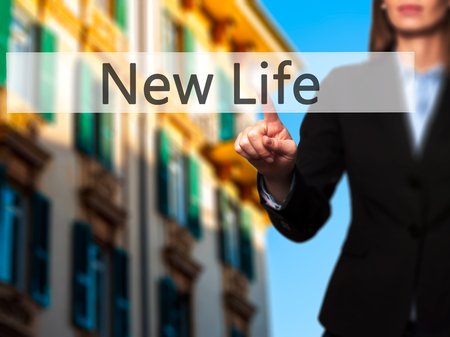 New Life - Businesswoman pressing modern  buttons on a virtual screen. Concept of technology and  internet. Stock Photoの写真素材