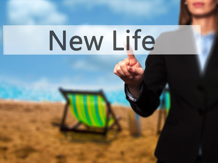 New Life - Businesswoman pressing modern  buttons on a virtual screen. Concept of technology and  internet. Stock Photoの写真素材