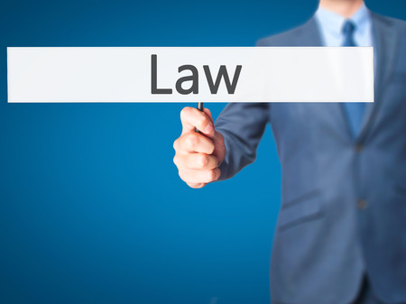 Law - Business man showing sign. Business, technology, internet concept. Stock Photoの写真素材