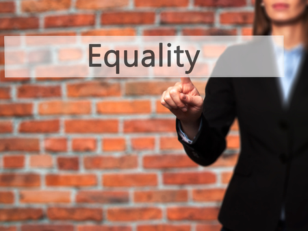 Equality - Businesswoman pressing modern  buttons on a virtual screen. Concept of technology and  internet. Stock Photoの写真素材