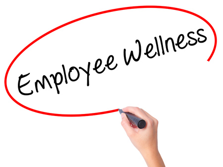 Women Hand writing Employee Wellness with black marker on visual screen. Isolated on white. Business, technology, internet concept. Stock Photoの写真素材