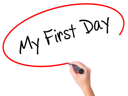 Women Hand writing My First Day with black marker on visual screen. Isolated on white. Business, technology, internet concept.の写真素材
