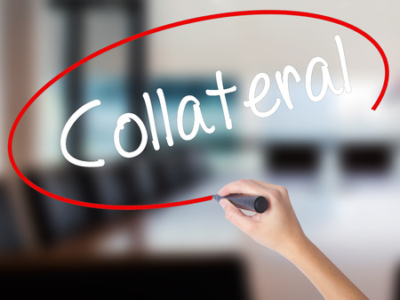 Woman Hand Writing Collateral with a marker over transparent board. Isolated on Office. Business concept. Stock Photoの写真素材