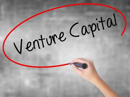 Man Hand writing Venture Capital with black marker on visual screen. Isolated on white. Business, technology, internet concept. Stock Photoの写真素材