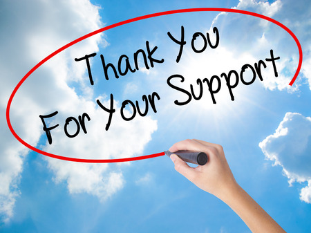 Woman Hand Writing Thank you For Your Support  with black marker on visual screen. Isolated on Sunny Sky. Business concept. Stock Photoの写真素材