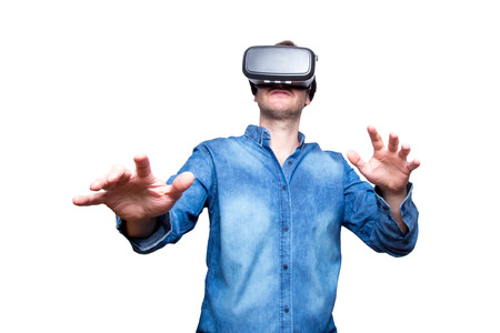 Closeup of bearded young man wearing virtual reality goggles. Smartphone using with VR headset....