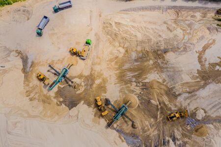 Aerial view of sandpit and factory plant producing sand materials for construction industry. Top view of large manufacturing plant in landscape. European union.の写真素材