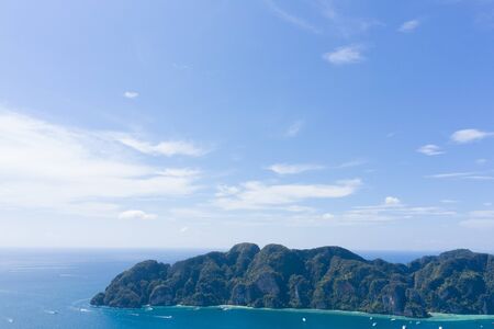 Beautiful panoramic view over Tonsai and Dalum Beach. Green jungles and hot stones on the bright sun of tropical island and the mountains in Andaman Sea. Phi Phi Viewpoint, Krabi, Thailandの写真素材