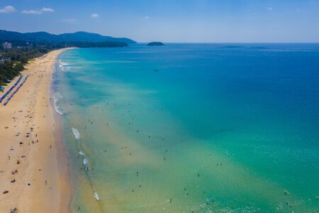Aerial:Beautiful beach. PHUKET, THAILAND Patong beach. sandy beach and blue transparent water. Umbrella. Water scooterの写真素材