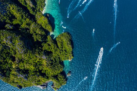 Beautiful panoramic view over Tonsai and Dalum Beach. Green jungles and hot stones on the bright sun of tropical island and the mountains in Andaman Sea. Phi Phi Viewpoint, Krabi, Thailandの写真素材