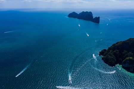 Aerial drone photo of iconic tropical turquoise water Pileh Lagoon surrounded by limestone cliffs, Phi phi islands, Thailand. Ao Pi Leh Lagoon at Beautiful sea and blue sky at Similan island,Thailandの写真素材
