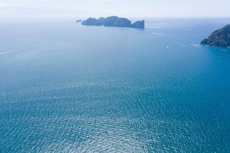 Aerial drone photo of iconic tropical turquoise water Pileh Lagoon surrounded by limestone cliffs,...
