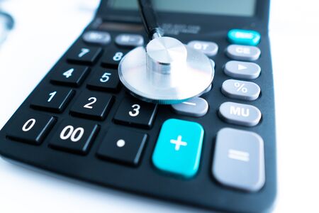 Health care costs. Stethoscope and calculator symbol for health care costs or medical insurance. concept for life planningの写真素材