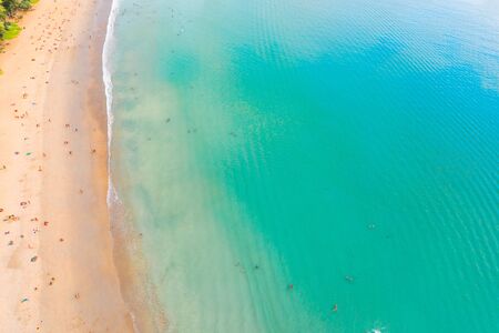 Kata  beach, Paradise beach with golden sand, crystal water and palm trees, Patong area on Phuket Island, Tropical travel destination, Thailand. Aerialの写真素材