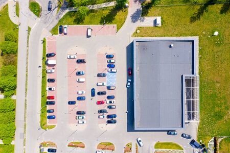 Big shopping mall of household goods with a lot of parking space, aerial viewの写真素材