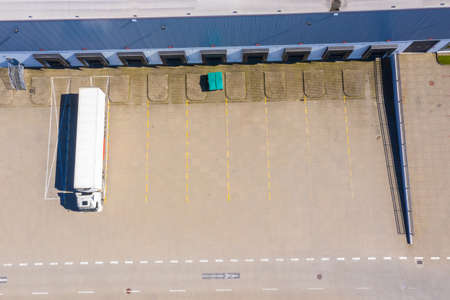Aerial view of goods warehouse. Logistics center in industrial city zone from above. Aerial view of...