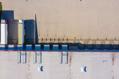 Aerial view of warehouse storages or industrial factory or logistics center from above. Aerial view...
