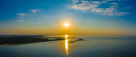 Minimalist aerial seascape - sunset over calm water. Baltic Sea.の写真素材