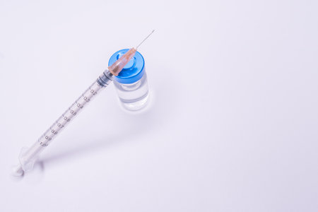 Vaccine vial dose flu shot drug needle syringe, medical concept vaccination hypodermic injection treatment disease care hospital prevention immunization illness disease baby child.の写真素材