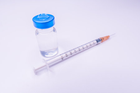 Vaccine and syringe injection. prevention, immunization and treatment from virus infection. Vaccine vial dose flu shot drug needle syringe.の写真素材