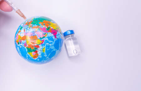 Medical drug vaccine syringe needle hypodermic injection treatment on map world, Medical concept tourism travel care diseases Healthyの写真素材