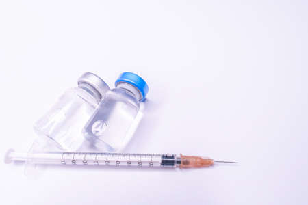 Medicine bottle for injection. Medical glass vials and syringe for vaccination. liquid drug or...