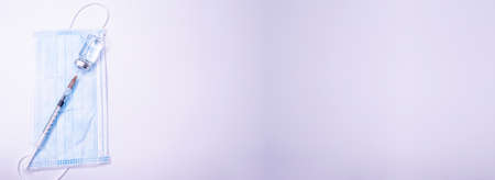 Medicine bottle for injection. Medical glass vials and syringe for vaccination. liquid drug or vaccine for treatment, flu in laboratory, hospital or pharmacy concept isolated on white background. Copy Spaceの写真素材