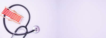 Stethoscope on map Medical concept turism travel care diseasea Healthy white background. selective focus stethoscope sunbed Copy Spaceの写真素材