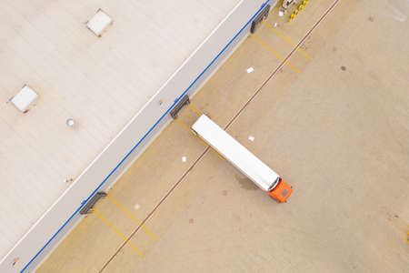 Aerial view of goods warehouse. Logistics delivery; center in industrial city zone from above....